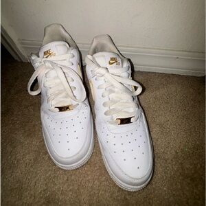 womens nike air forces with gold accents